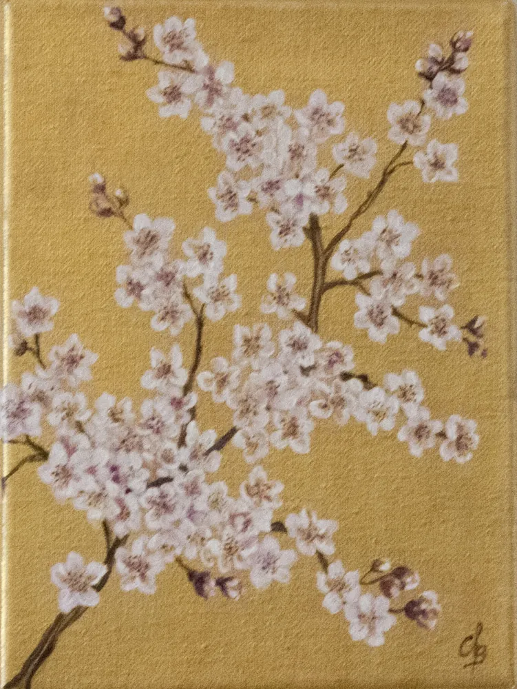 Branches de cerisier en fleurs peintes sur un fond de feuille d'or